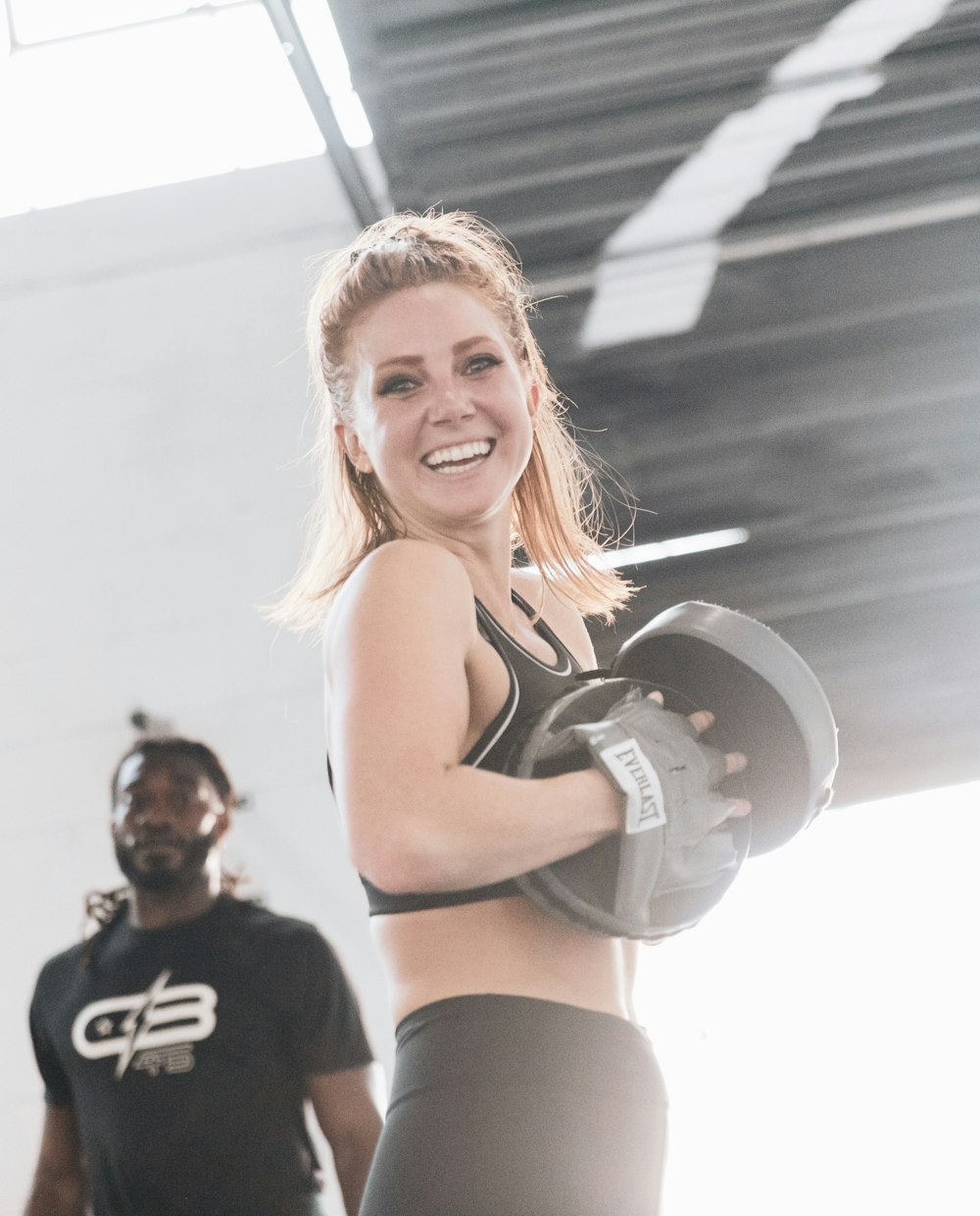 A coach training a client during a session